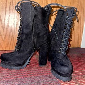 High heeled black boots